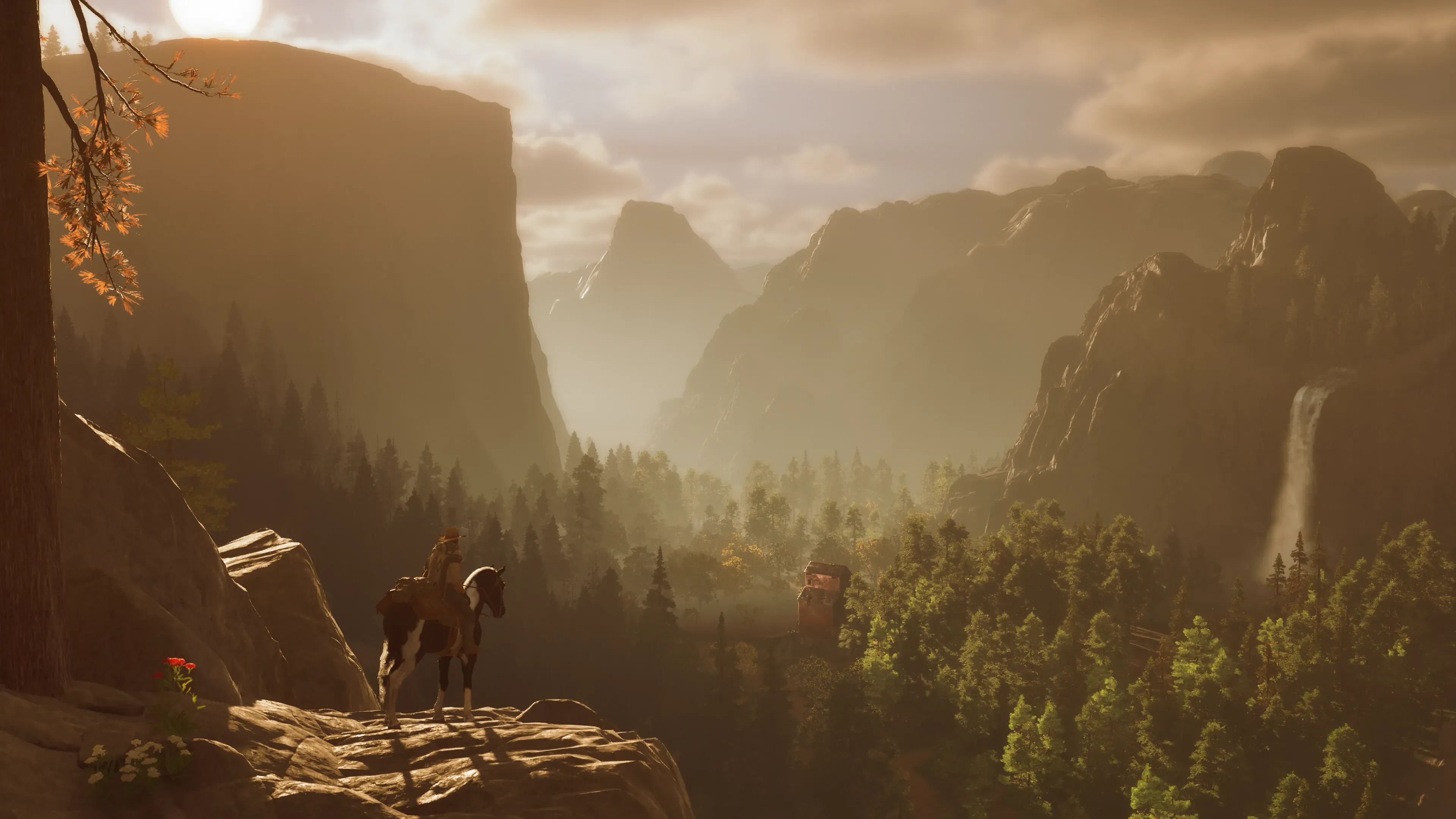 A river valley cutting through golden hills at sunrise.